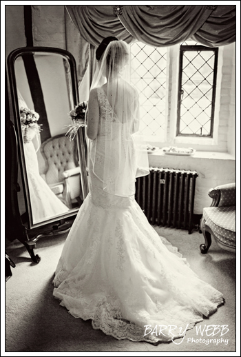 Bride looking in mirror