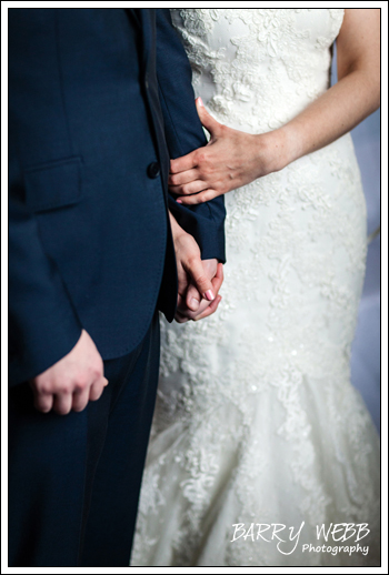 Bride and groom holding hands