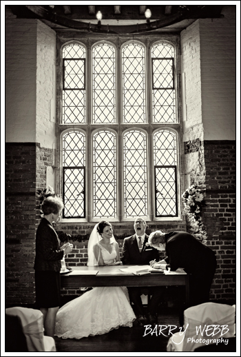 Big smiles signing the register