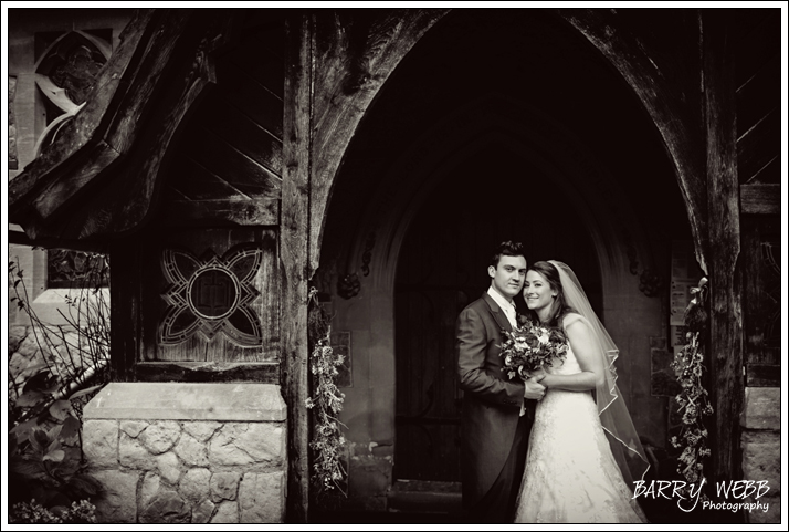 The Bride and Groom posing at the Church