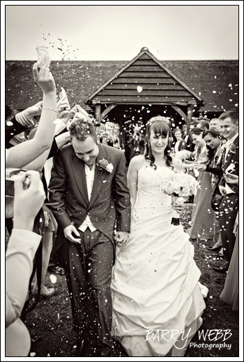 Convetti down the back at Castle Cooling Barn in Kent - Wedding Photography