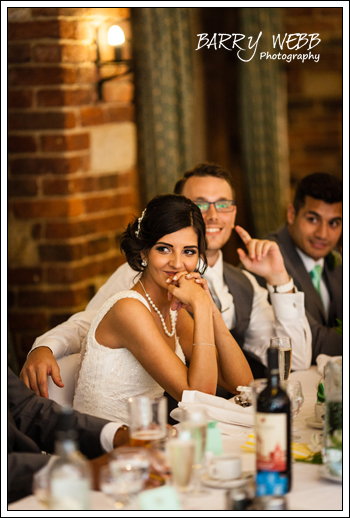 The Bride looks on