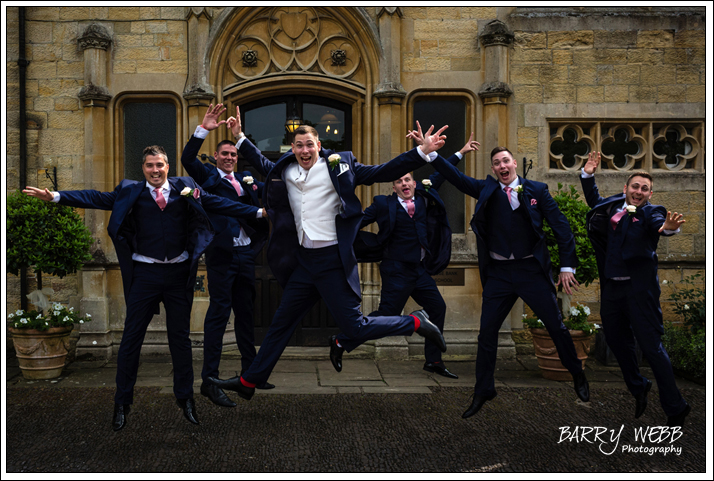 Groomsmen jump for joy