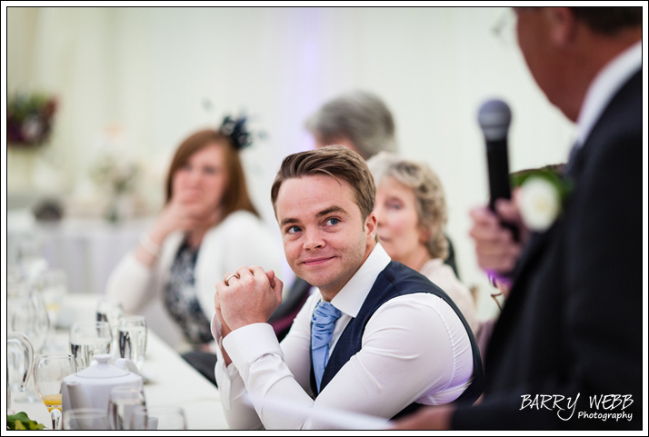 Groom looking on